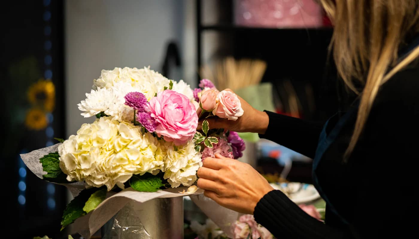 Fresh flowers being arranged into a bouquet